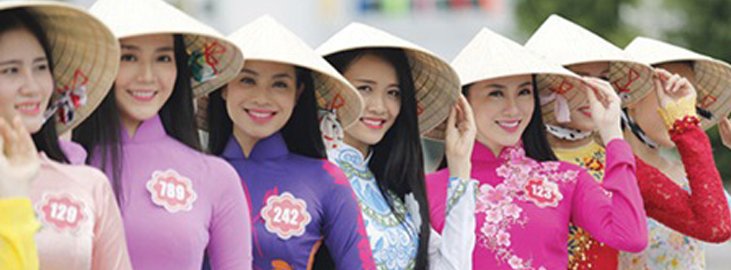 Vietnams Girls with cultural hats- Angel Holidays Tour